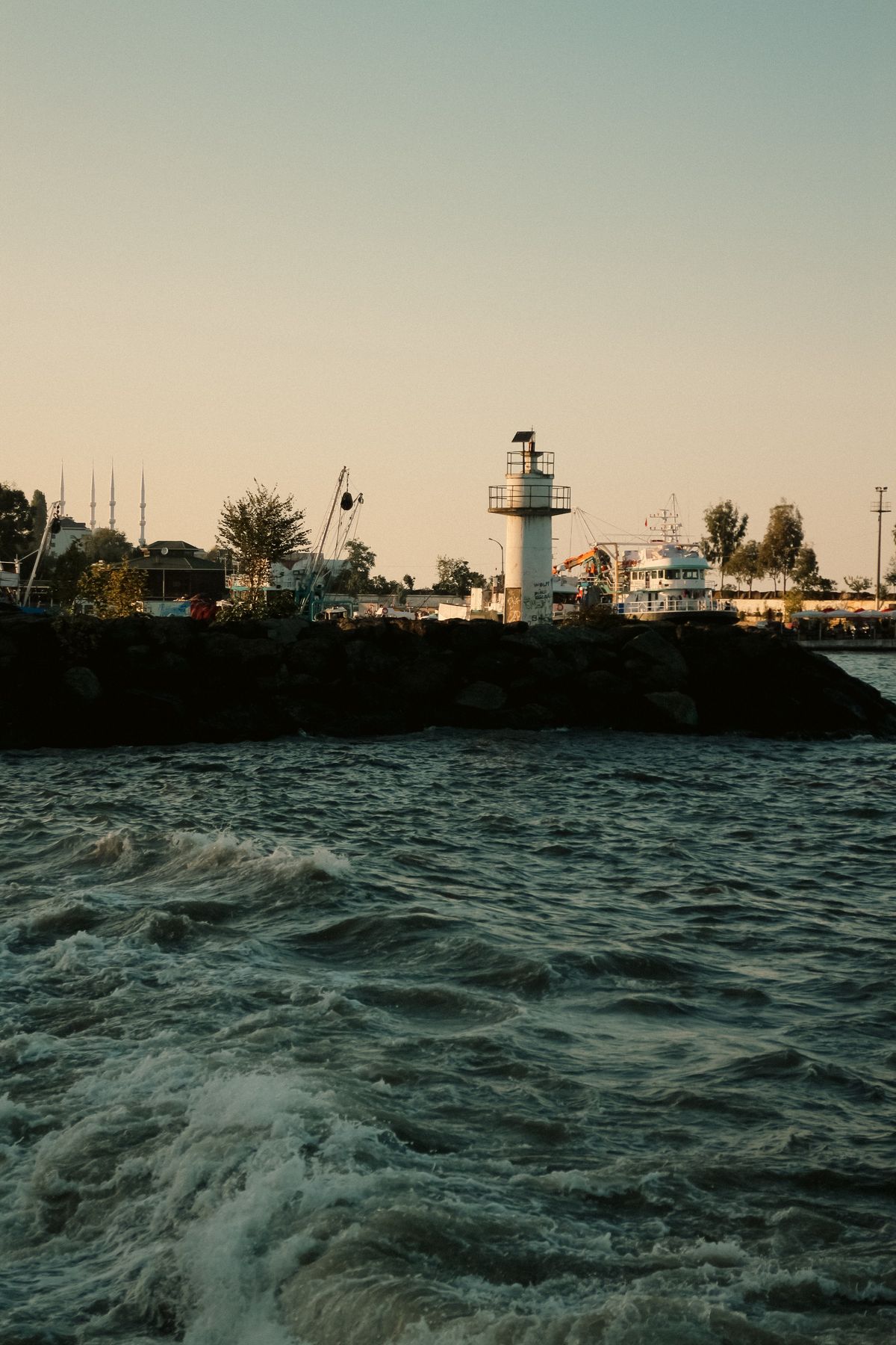 Lighthouse by the sea at dusk