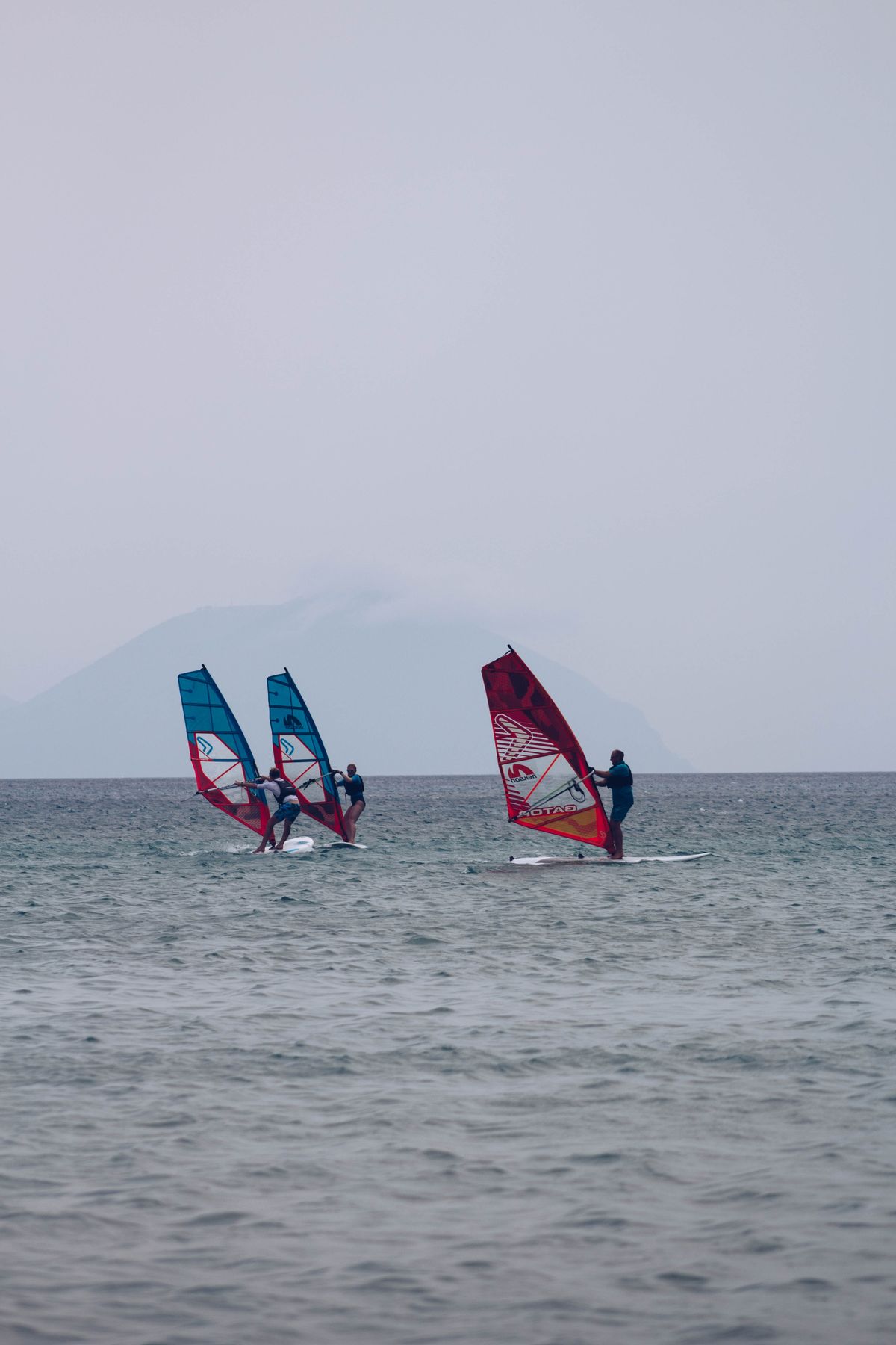 Windsurfers riding the north-coast wind